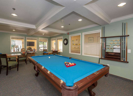 Game room with billiards table at Campus Commons Senior Living, Sacramento 