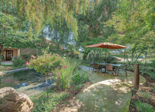 Outdoor courtyard with water feature at Campus Commons Senior Living, Sacramento, 95825
