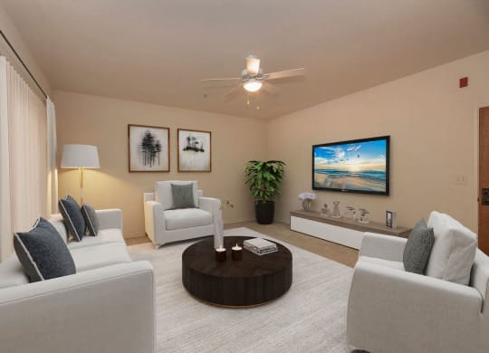 a living room with white couches and a coffee table at Winding Commons Senior Living, Carmichael
