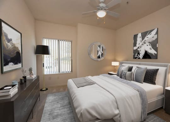 a bedroom with a bed and a ceiling fan at Winding Commons Senior Living, Carmichael, CA