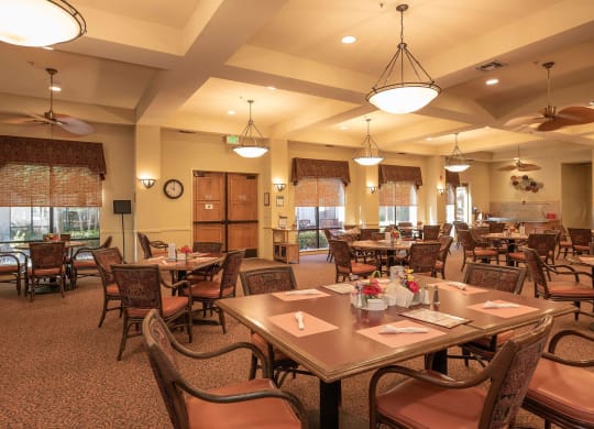 a large dining room with tables and chairs at Winding Commons Senior Living, Carmichael, CA, 95608