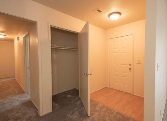 a bedroom with a closet and a door to a bathroom at Castle Vista Senior Duplex Community, Atwater, CA