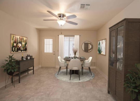 a dining room with a ceiling fan and a table and chairs at Castle Vista Senior Duplex Community, Atwater, CA