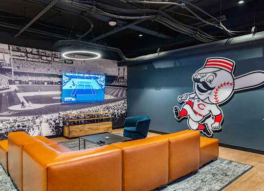 a wall mural of a baseball player in a room at Textile Apartments, Cincinnati