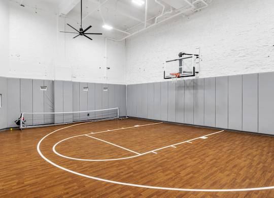 the gym has a hardwood floor and a basketball hoop at Textile Apartments, Ohio, 45202