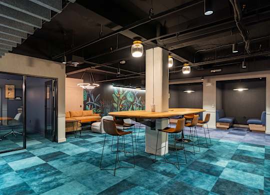 a large meeting room with a table and chairs at Textile Apartments, Ohio, 45202