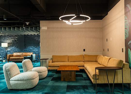 a living room with couches chairs and a table at Textile Apartments, Cincinnati, OH, 45202