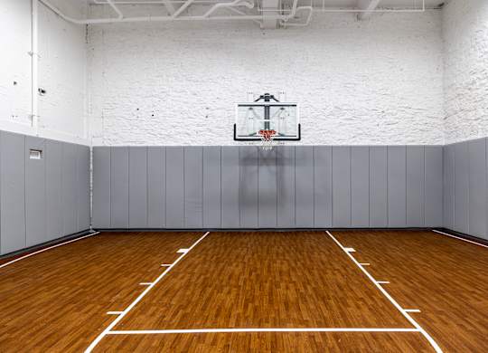 an empty basketball court in a gym with a basketball hoop at Textile Apartments, Cincinnati, OH, 45202