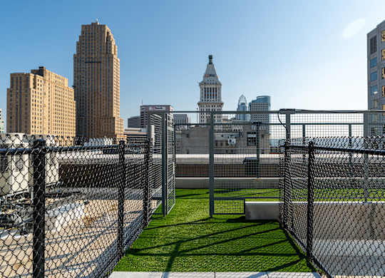 a view of the city from the top of a fenced in field at Textile Apartments, Ohio