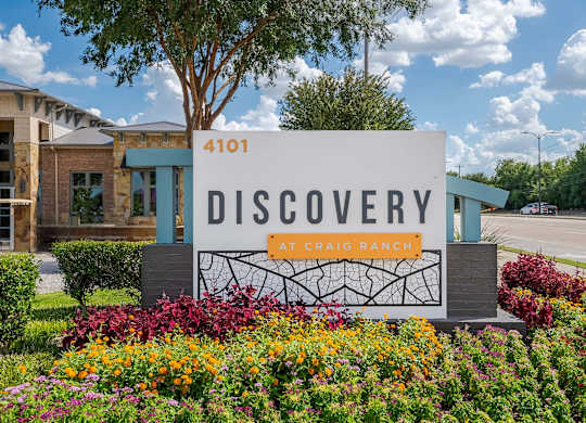 a sign for the discovery at craig ranch in front of a building at Discovery at Craig Ranch, McKinney, 75070