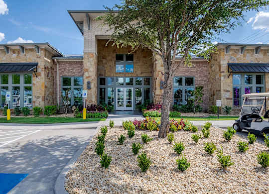 a building with a golf cart parked in front of it at Discovery at Craig Ranch, McKinney, TX, 75070