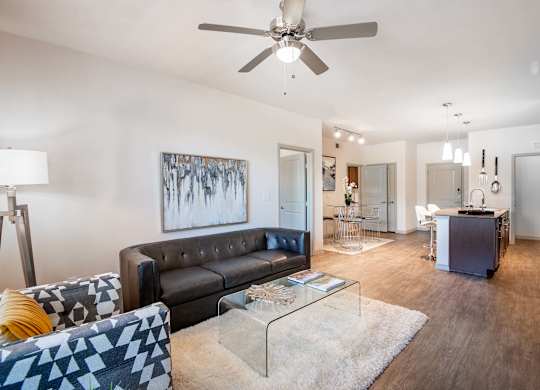 a living room with a couch and a glass table at Discovery at Craig Ranch, McKinney, TX
