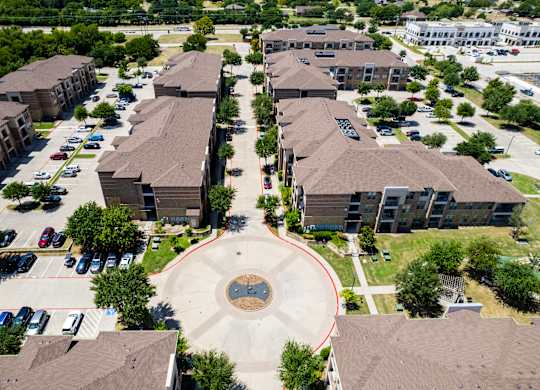 an aerial view of a neighborhood with houses and buildings and a circle in the middle at Discovery at Craig Ranch, McKinney, 75070