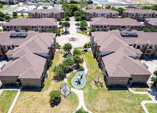 an aerial view of a neighborhood with houses and a playground at Discovery at Craig Ranch, McKinney, TX