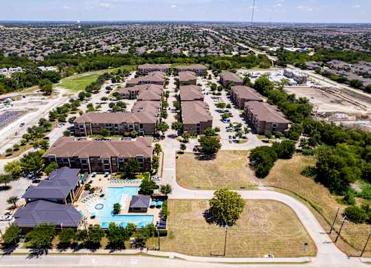 an aerial view of a neighborhood with houses and a swimming pool at Discovery at Craig Ranch, McKinney, TX