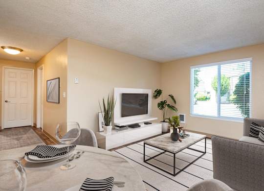 our apartments offer a living room and dining room with a tv