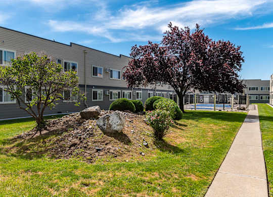 Americana | Outdoor Pool, Exterior Building and Walkway