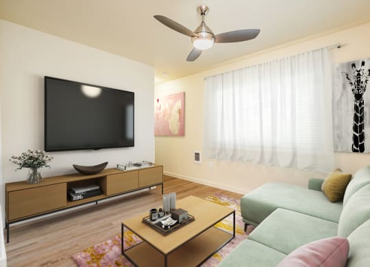 a living room with a couch and a television on the wall