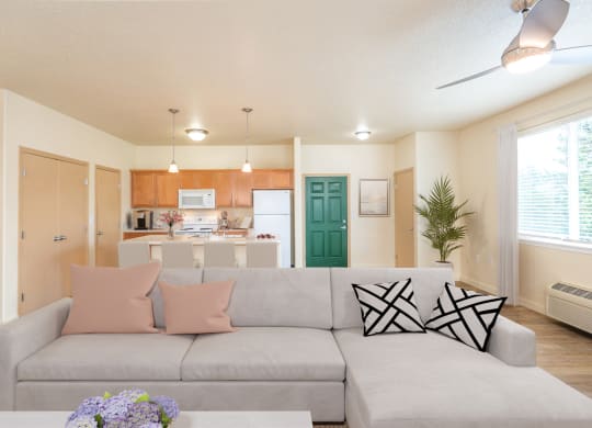 a living room with a couch and a table with pillows