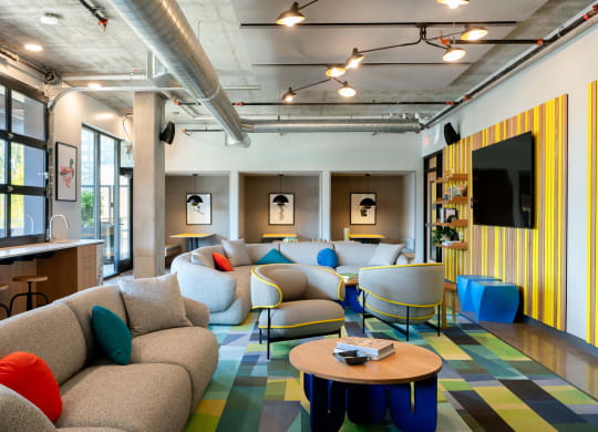 a resident lounge  with couches and chairs and a table