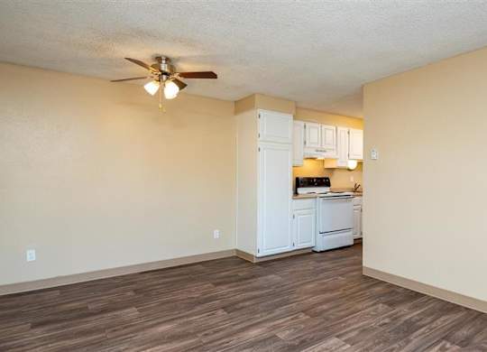 A kitchen area with a refrigerator, stove, and oven.