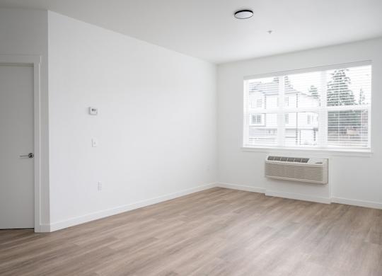 A room with a window and a door.