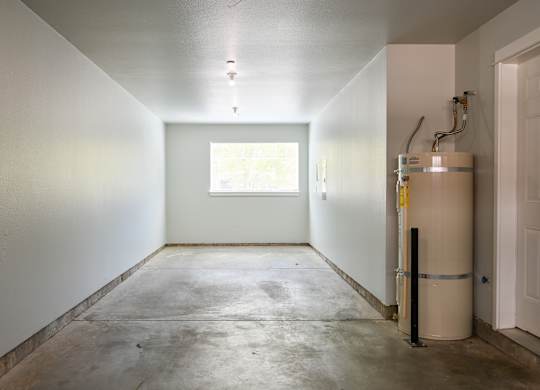 A room with a window and a white door.