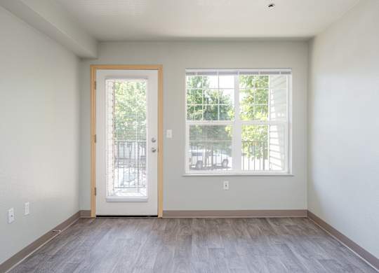 A room with a door and a window.