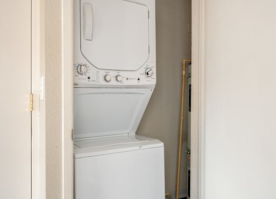 stackable washer and dryer in a closet