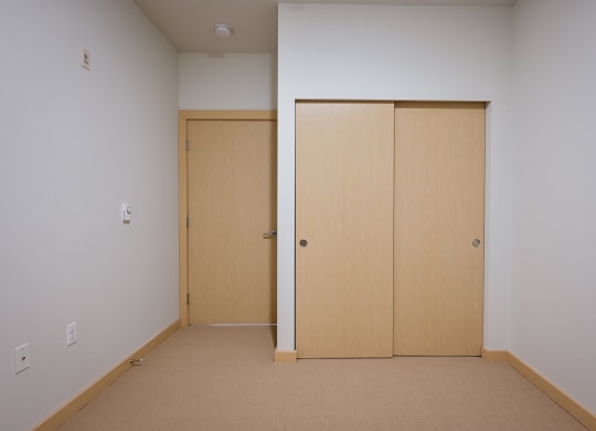 bedroom with double closet doors