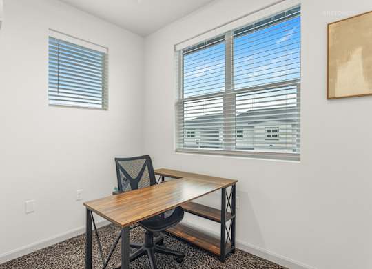 A room with a table and a chair.
