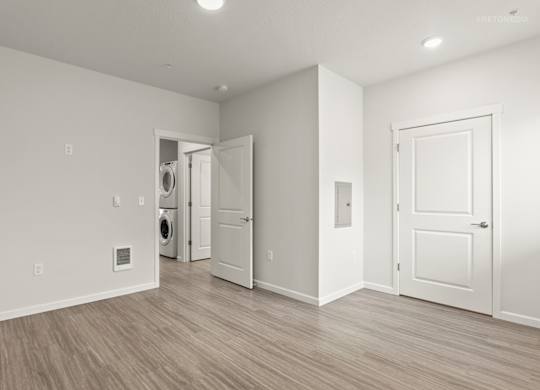 A room with a washer and dryer in it.