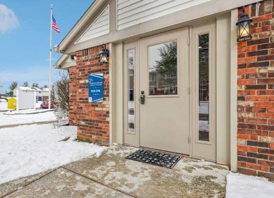 The entrance to a building with a sign that reads "100" on it.