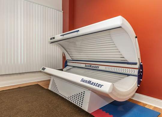 A SunMaster solar panel is installed on a wall.