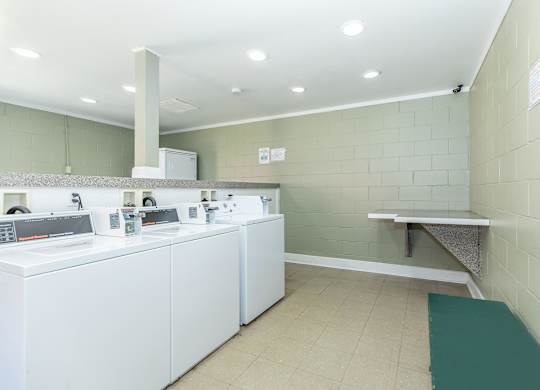 A laundromat with washers and dryers.