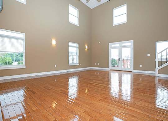A room with wooden floors and a skylight.