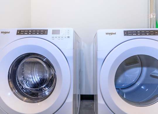 Two Whirlpool washing machines side by side.