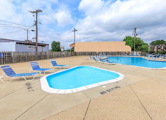 A pool with a no diving sign on the ground.
