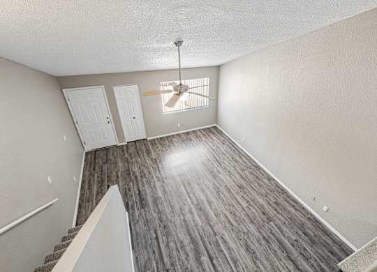 A room with a staircase leading to the second floor.