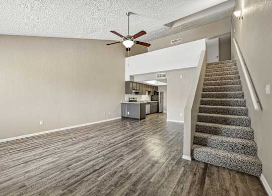 A room with a staircase leading to the upper floor.