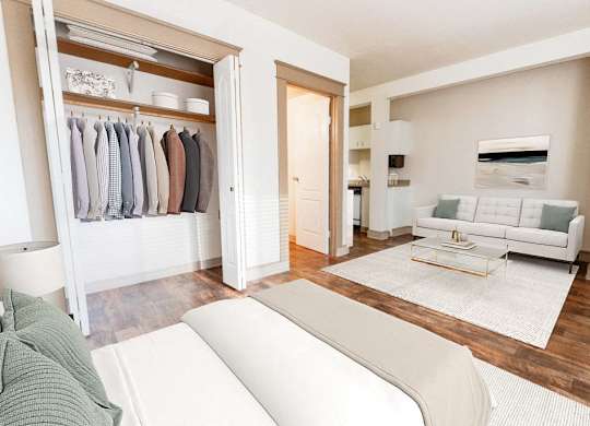a living room with a white couch and a closet at Zindorf, Seattle, 98104