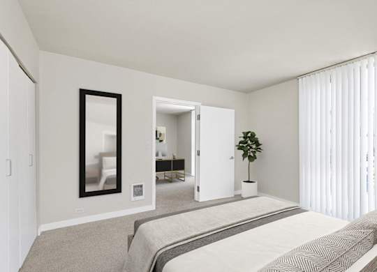 A bedroom with a large bed and a mirror on the wall.