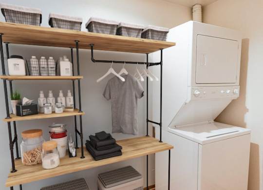 A small kitchen with a white refrigerator and wooden shelves with various items on them.
