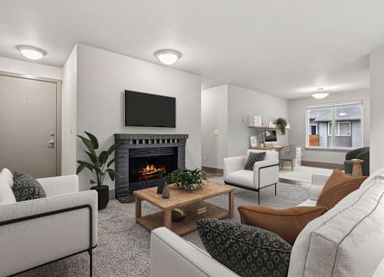 A living room with a fireplace and a flat screen TV mounted above it.