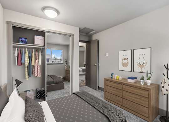 A bedroom with a bed, dresser, and a mirror.