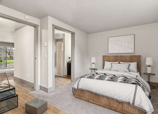 A bedroom with a large bed and a wooden headboard.