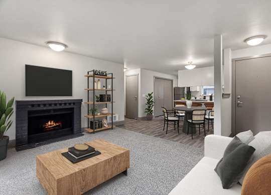 A modern living room with a fireplace and a television.