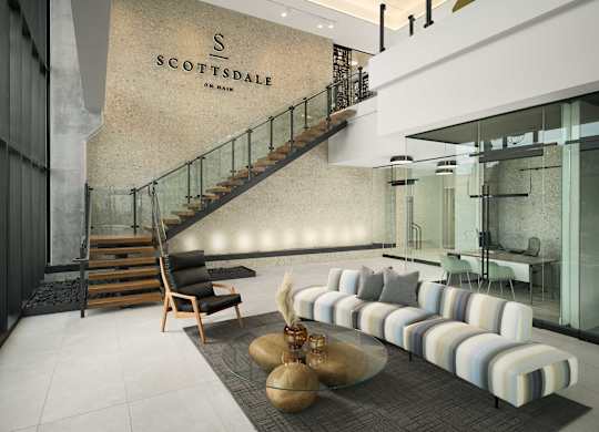 A modern living room with a staircase and a sofa.