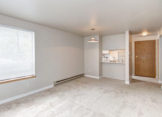 Seattle Apartments-  living area with natural light and kitchen