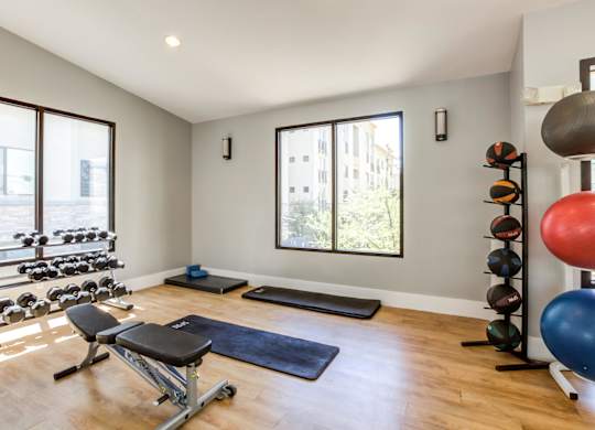 A well-equipped home gym with a variety of exercise equipment.